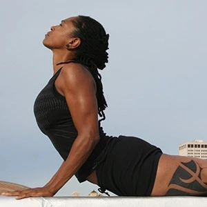 Richelle Donigan in sun salutation yoga pose